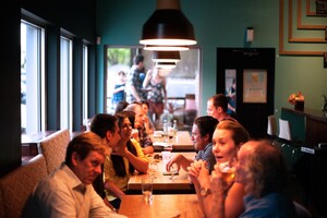 lively patrons seated at restaurant tables