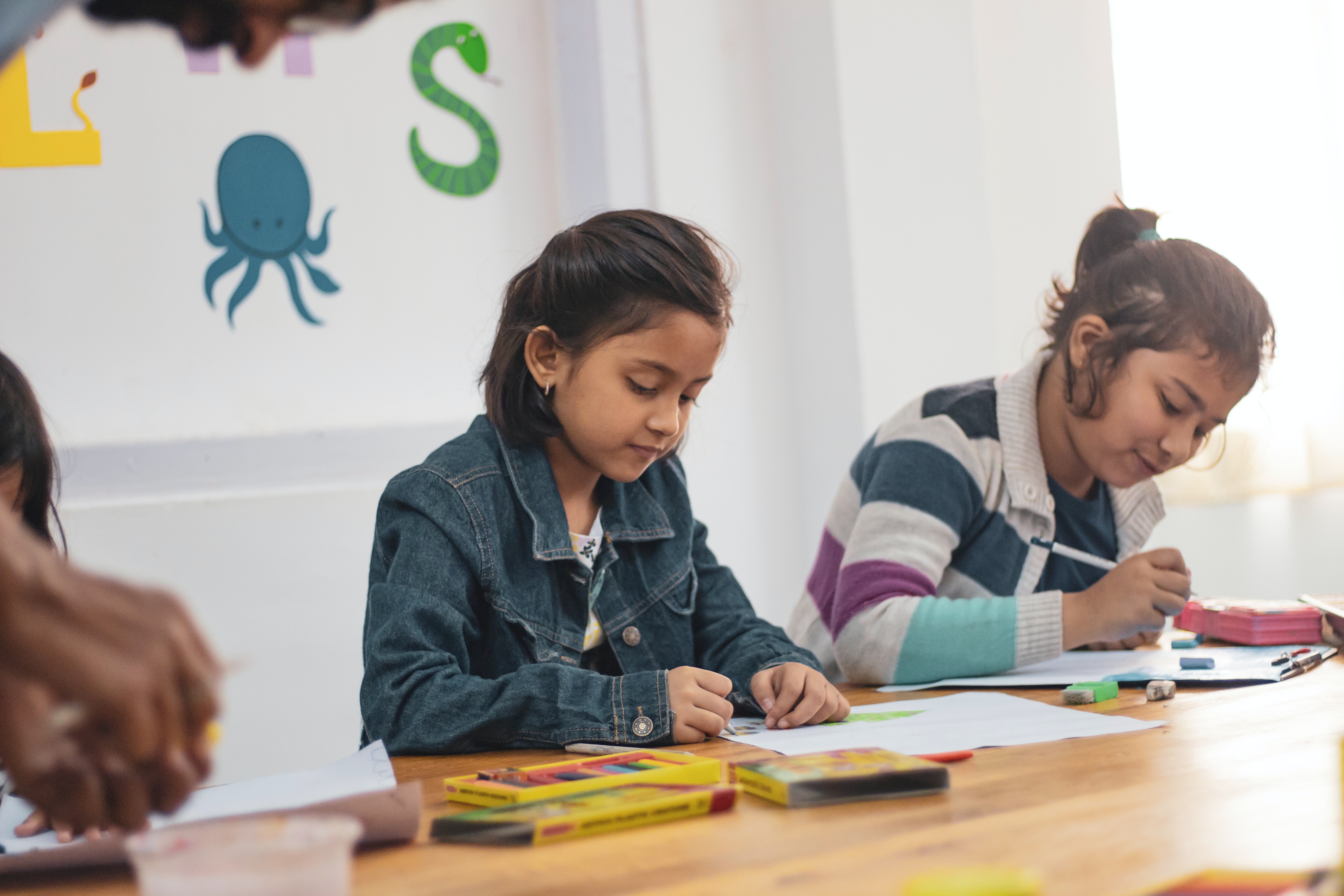 kids drawing and writing in school