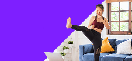 A Woman working out at home. (Getty Images)