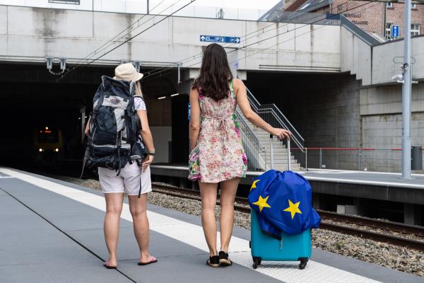 Two female passengers waiting for their train on the platform