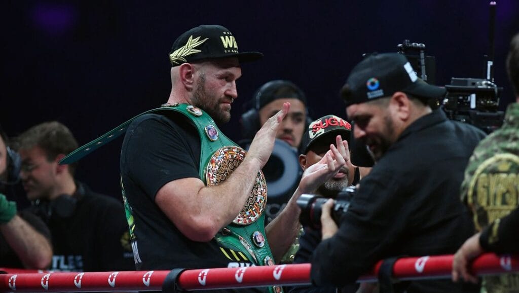 Tyson Fury, of England, the WBC and lineal heavyweight champion, celebrates with his belt after winning the WBC heavyweight title.