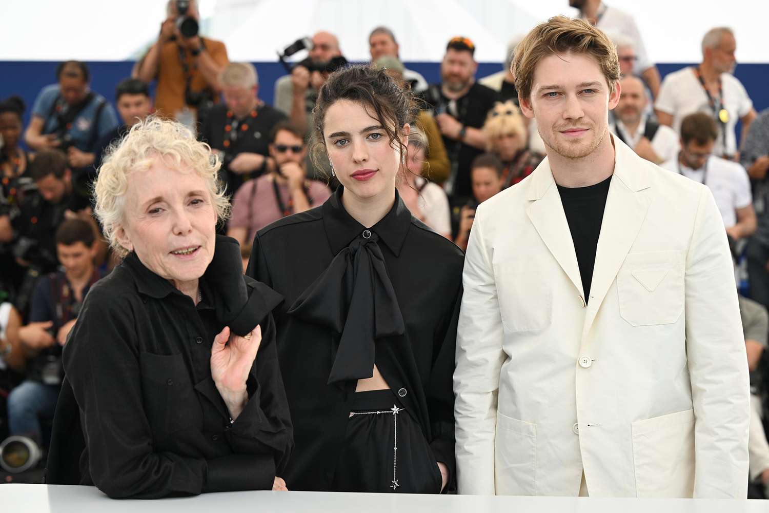 Claire Denis, Margaret Qualley and Joe Alwyn attend the photocall for "Stars At Noon" during the 75th annual Cannes film festival at Palais des Festivals on May 26, 2022 in Cannes, France.