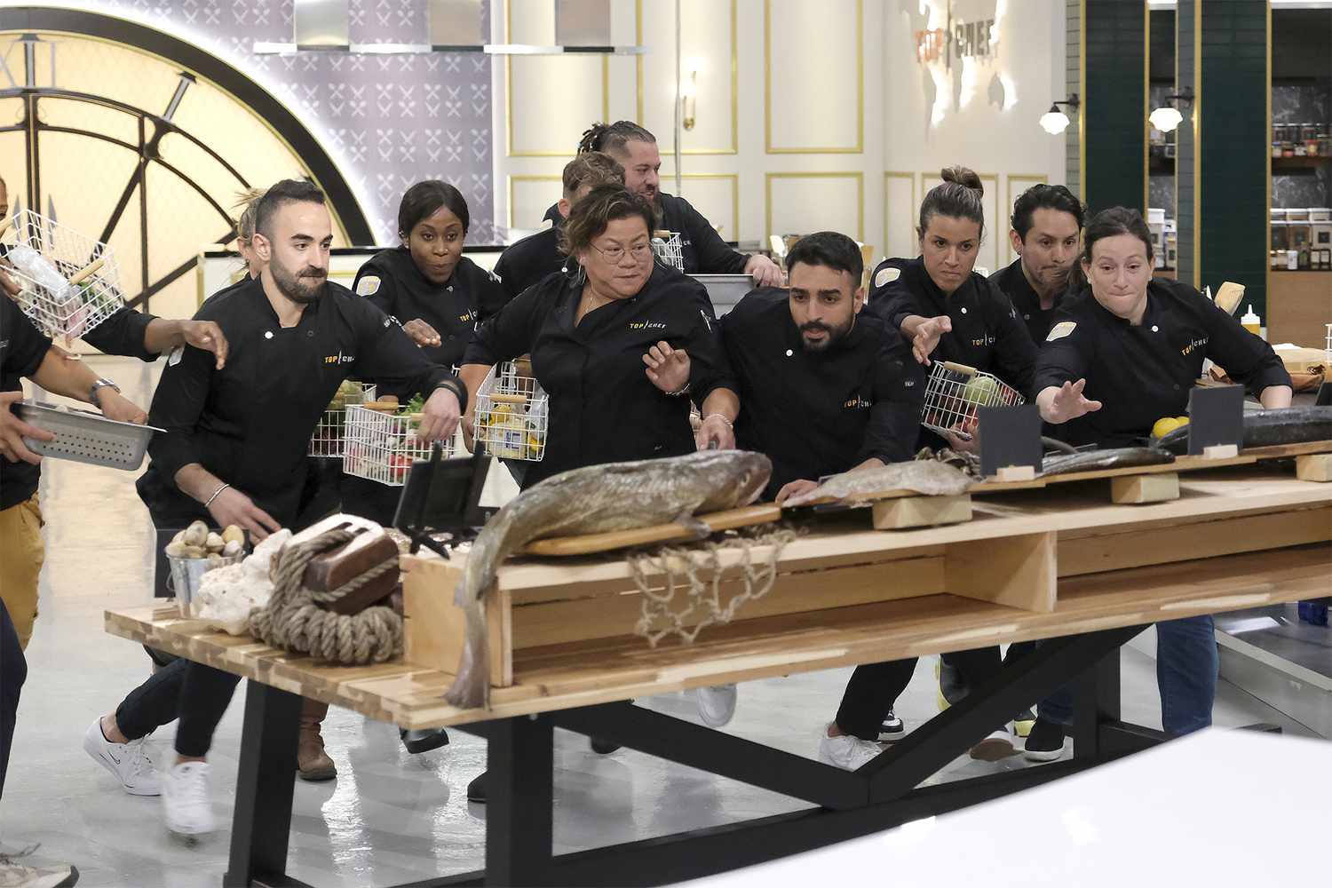 TOP CHEF -- Episode 2001 -- Pictured: (l-r) Charbel Hayek, Victoire Gouloubi, Nicole Gomez, Amar Santana, Ali Al Ghzawi, Luciana Berry, Gabriel Rodriguez, Sara Bradley -- (Photo by: David Moir/Bravo)