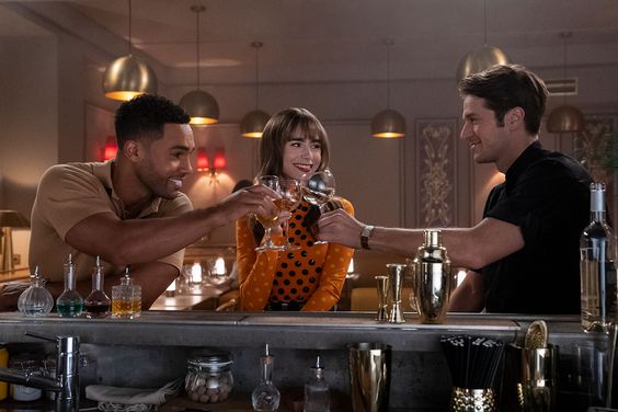 Emily in Paris. (L to R) Lucien Laviscount as Alfie, Lily Collins as Emily, Lucas Bravo as Gabriel in episode 305 of Emily in Paris. Cr. Stéphanie Branchu/Netflix © 2022