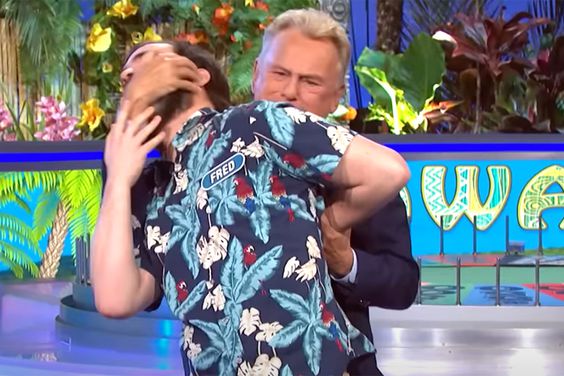 Pat Sajak wrestles a contestant on 'Wheel of Fortune'