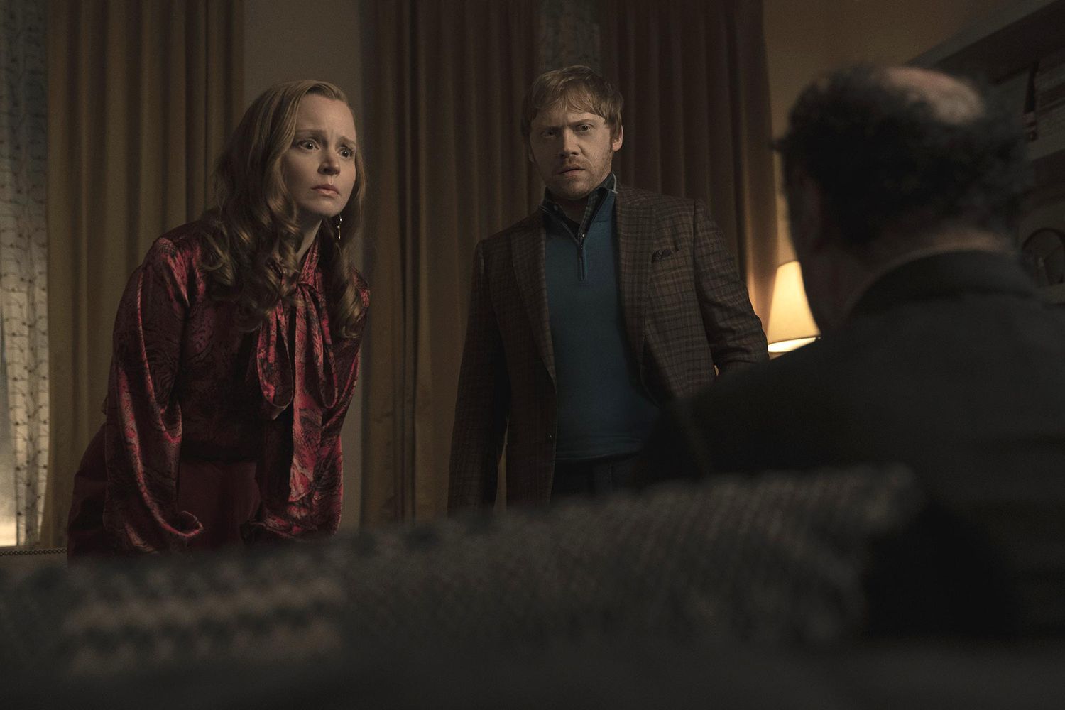 Lauren Ambrose and Rupert Grint in “Servant,” now streaming on Apple TV+.