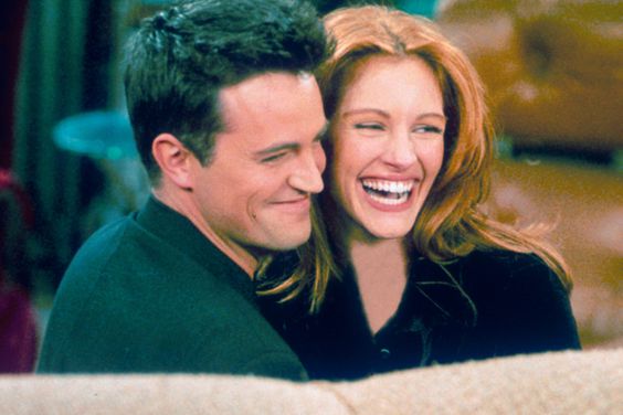 304422 21: Actor Matthew Perry and actress Julia Roberts hug each other on the set of "Friends." (Photo by Liaison)