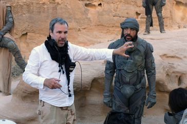 DUNE, from left: director Denis Villeneuve, Javier Bardem, on-set