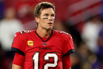 Tom Brady #12 of the Tampa Bay Buccaneers looks on during pregame warm-ups prior to a game against the Baltimore Ravens at Raymond James Stadium on October 27, 2022 in Tampa, Florida.