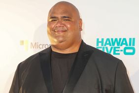 Actor Taylor Wily poses for a photo as he arrives at the CBS 'Hawaii Five-0' Sunset On The Beach Season 7 Premier Event at Queen's Surf Beach on September 23, 2016 in Waikiki, Hawaii.