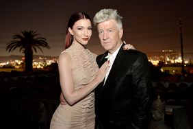 Singer Chrysta Bell (L) and director David Lynch pose before Bell's performance at The Hollywood Forever Cemetery on May 12, 2013 in Los Angeles, California. 