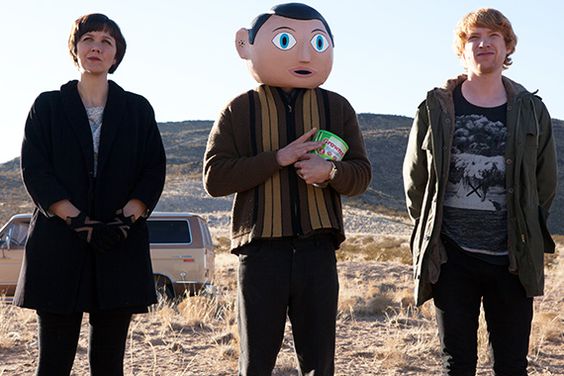 Michael Fassbender plays a saintly-kook man-child of an indie-rock lead singer who wears a big, round papier-mach&eacute; head that he never takes off. He's literally