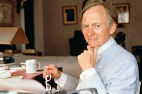 Novelist Tom Wolfe Seated at Desk