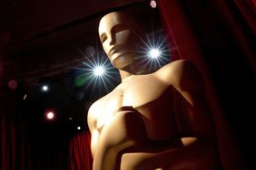 An Oscar statue stands as preparations are made along the red carpet ahead of the 95th Academy Awards, in Hollywood, California, on March 12, 2023