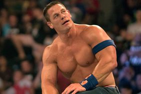 John Cena sitting on ropes during match at Barclays Center. 