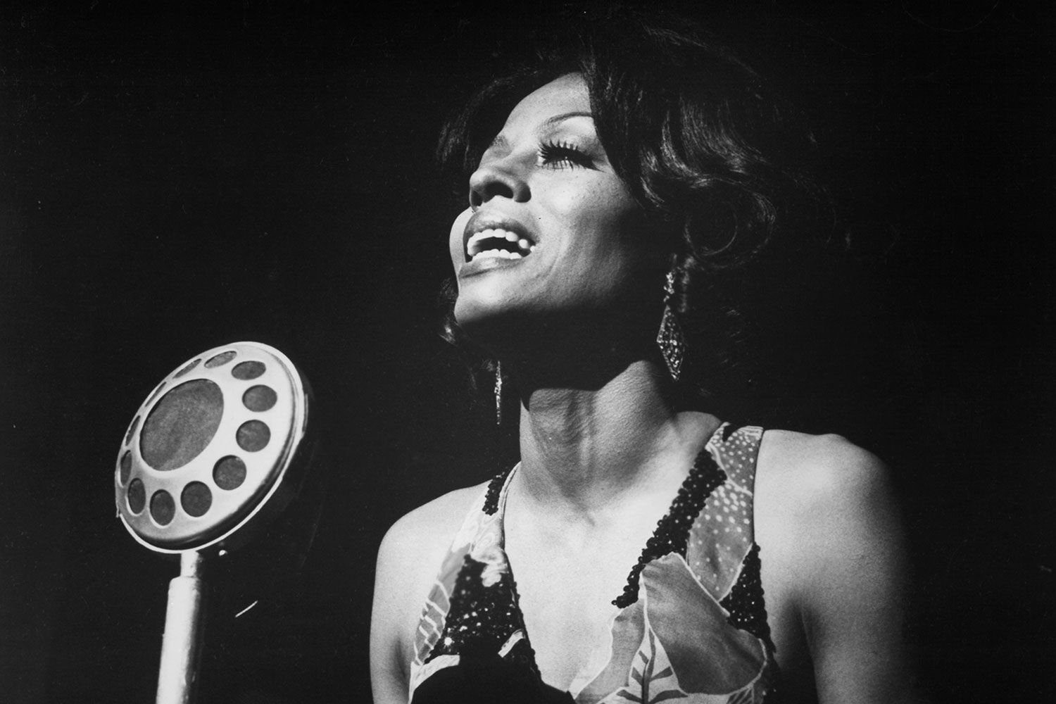 Diana Ross singing into the microphone in a scene from the film 'Lady Sings The Blues', 1972. 