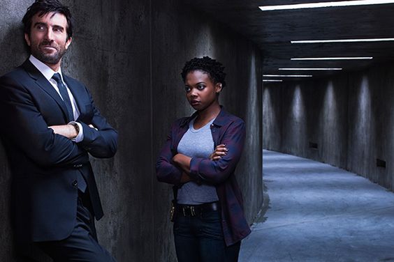 Det. Deena Pilgrim (Susan Heyward) and Det. Christian Walker (Sharlto Copley)