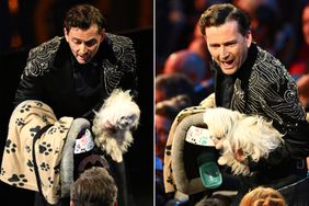Host David Tennant on stage with dog named Bark Ruffalo during the EE BAFTA Film Awards