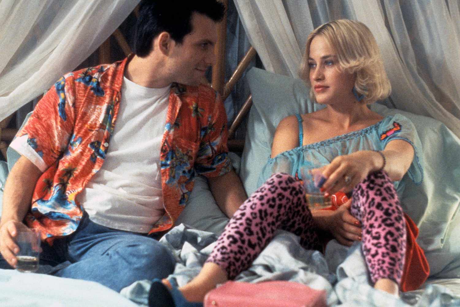 Christian Slater sits in bed with Patricia Arquette in a scene from the film 'True Romance', 1993. (Photo by Warner Brothers/Getty Images)