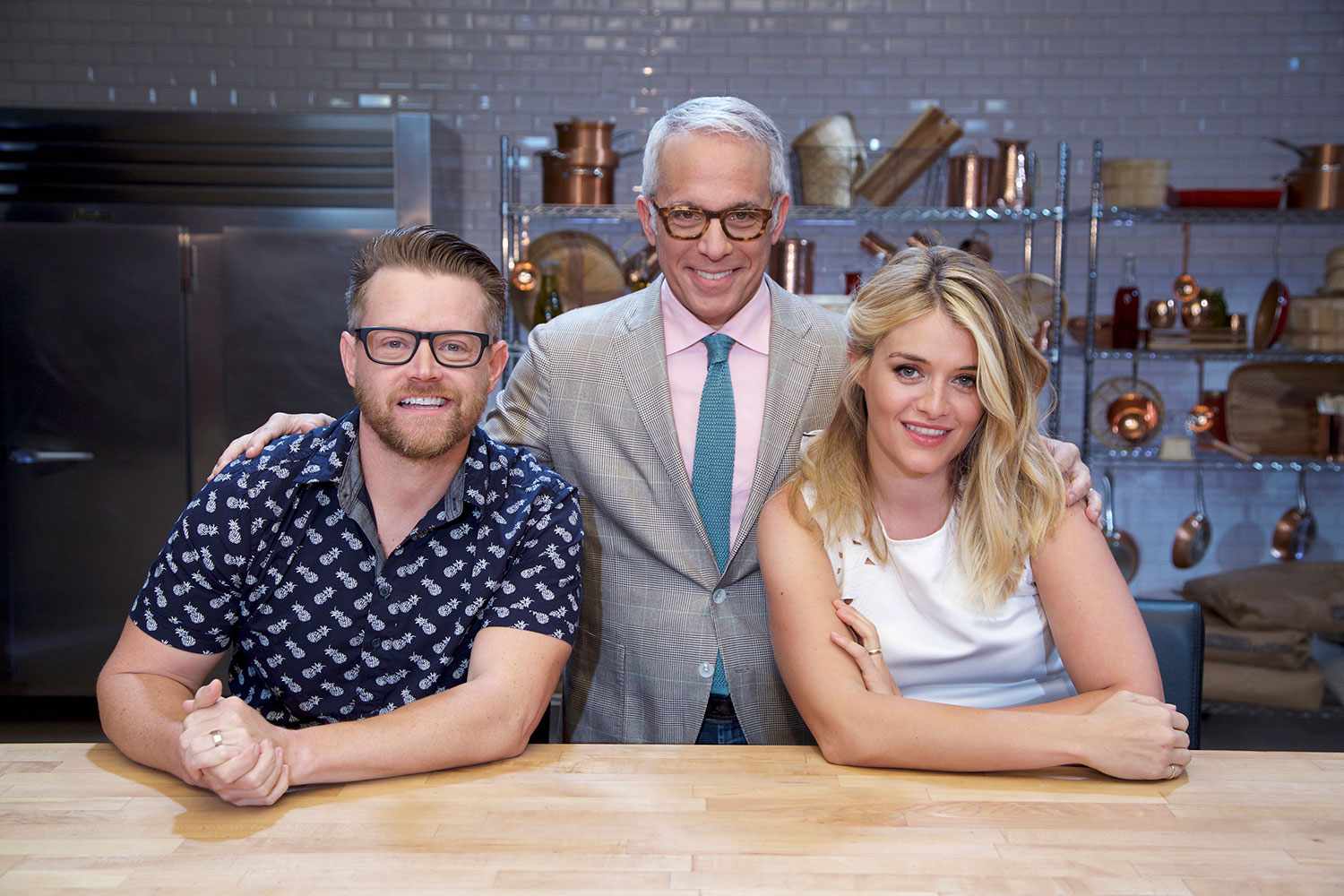 Judge Richard Blaise, Host Geoffrey Zakarian, and Judge Daphne Oz pose on set, as seen on Food Network's Cooks vs. Cons