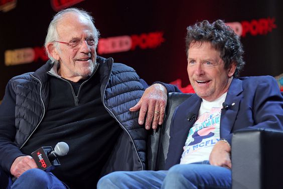 Actors Christopher Lloyd (L) and Michael J. Fox attend a "Back To The Future Reunion" at New York Comic Con on October 08, 2022 in New York City.
