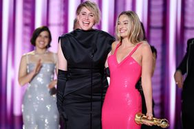 Greta Gerwig and Margot Robbie accept the award for Cinematic and Box Office Achievement for "Barbie" at the 81st Golden Globe Awards held at the Beverly Hilton Hotel on January 7, 2024