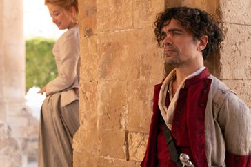 Haley Bennett stars as Roxanne and Peter Dinklage as Cyrano in Joe Wright’s CYRANO