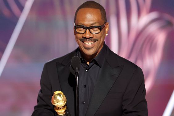 BEVERLY HILLS, CALIFORNIA - JANUARY 10: 80th Annual GOLDEN GLOBE AWARDS -- Pictured: Honoree Eddie Murphy accepts the Cecil B. DeMille Award onstage at the 80th Annual Golden Globe Awards held at the Beverly Hilton Hotel on January 10, 2023 in Beverly Hills, California. -- (Photo by Rich Polk/NBC via Getty Images)