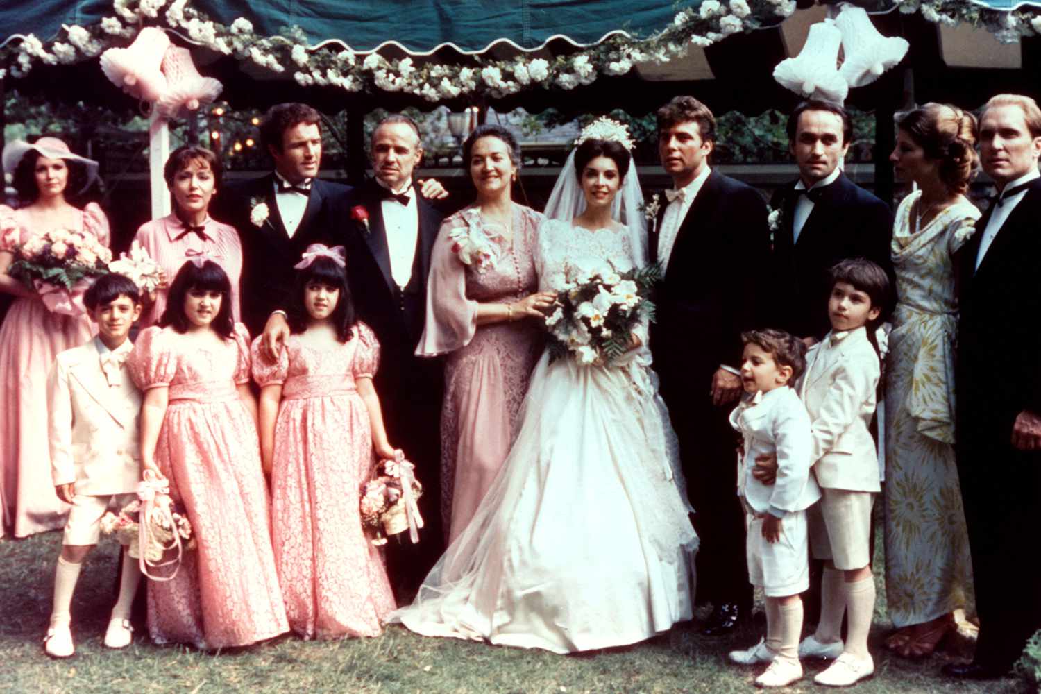 James Caan, Marlon Brando and the rest of the wedding party in a scene from the film 'The Godfather', 1972. (Photo by Warner Brothers/Getty Images)