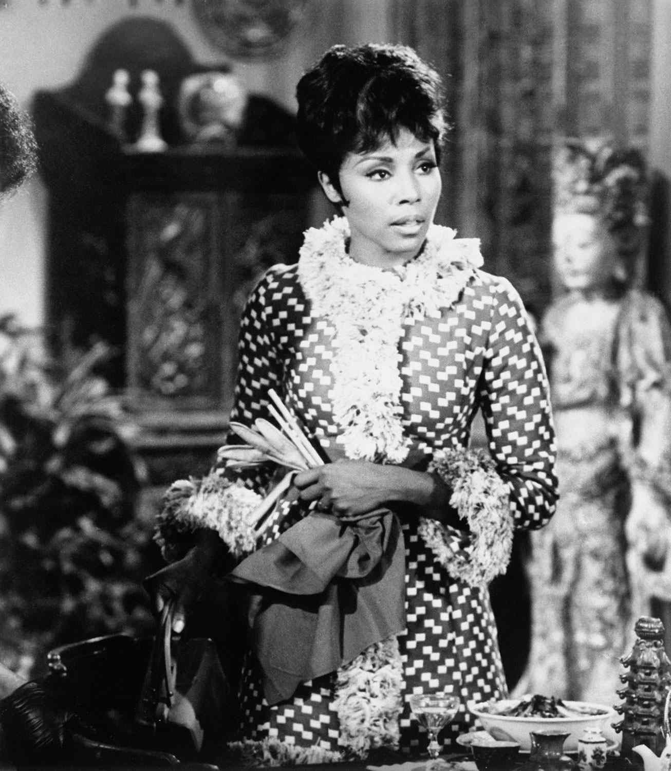 (Original Caption) Hollywood: Fashion Plate -- That's Diahann Carroll, this season's successful 20th Century Fox series star in her title role as Julia. Miss Carroll appears as Julia every Tuesday at 8:30 P.M. on NBC-TV in her Woolmark wardrobe created by Travilla.