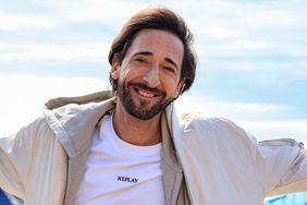 Adrien Brody poses during the Monte Carlo ATP Masters Series Tournament with the the Rainier III court in the background at the Monte Carlo Country Club on April 10, 2024