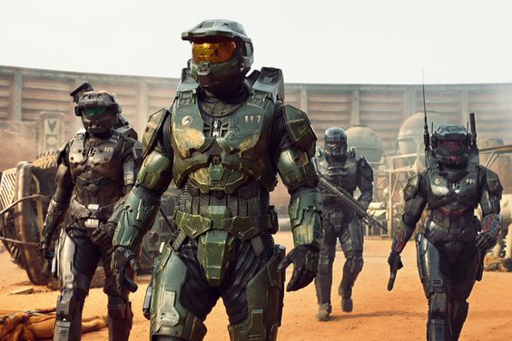 Pablo Schreiber as Master Chief, Kate Kennedy as Kai, Bentley Kalu as Vannak, and Natasha Culzac as Riz in Halo Season 1, streaming on Paramount+ 2022.