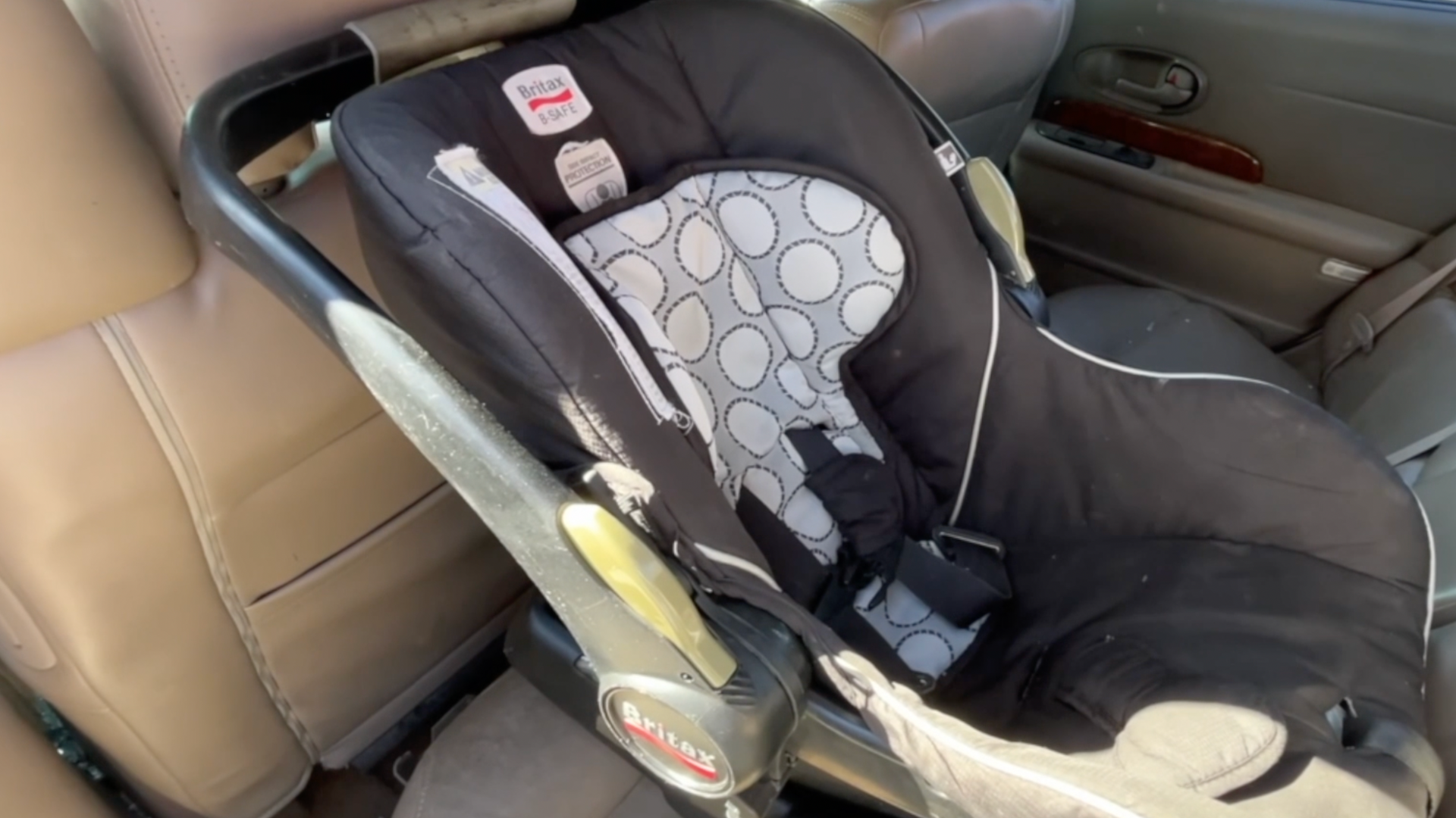 Baby car seat in the back of a car.