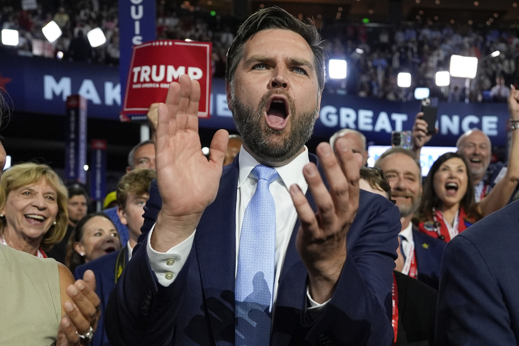 Republican vice presidential candidate Ohio Sen. J.D. Vance arrives on the floor during the first day of the 2024 Republican National Convention.