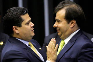 President of Brazil's Lower House Rodrigo Maia greets President of Brazil's Senate Davi Alcolumbre during an opening session of the Year of the Legislative in Brasilia