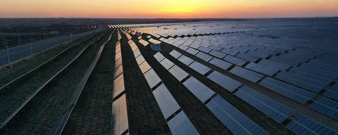 Solar panels are seen during sunset at the Tengger Desert Solar Park in China's northern Ningxia region on August 21, 2024. (Photo by GREG BAKER / AFP)