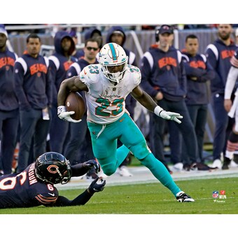 Unsigned Miami Dolphins Jeff Wilson Jr. Fanatics Authentic Shakes Past Defense Photograph