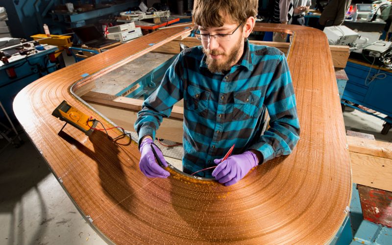 Steve Krave working on magnet coil