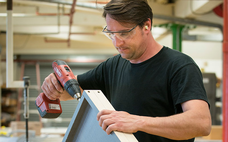 Dana Smith working in carpenter shop