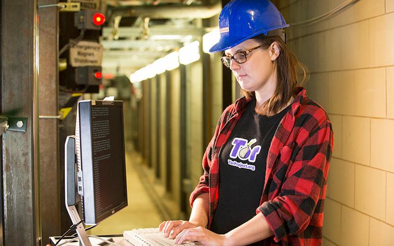 Bonnie King working on computers in the MINOS Hall