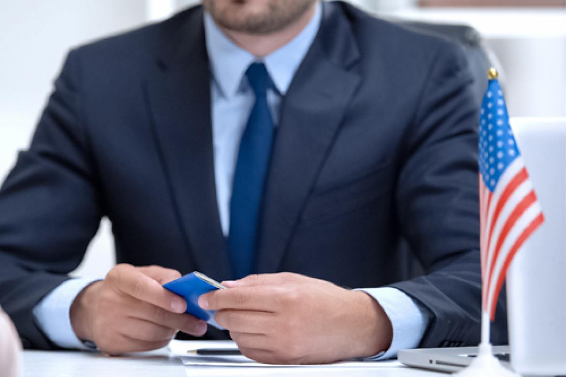 Man holding passport.