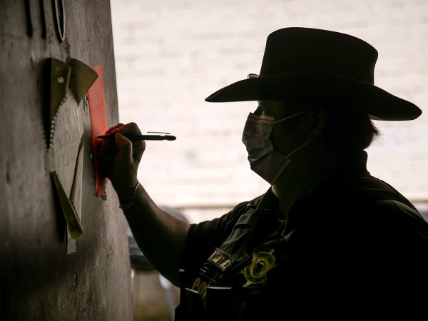 A Maricopa County constable signs an eviction order