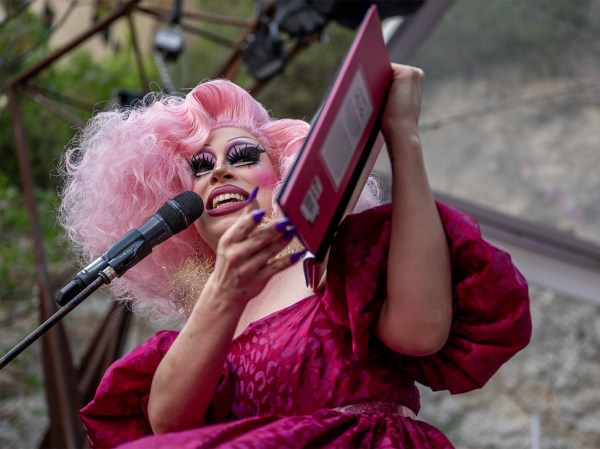 Drag Queen Brigitte Bandit reads a book during a story time