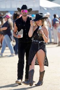 INDIO, CALIFORNIA - APRIL 28: (FOR EDITORIAL USE ONLY) Festivalgoers attend the 2024 Stagecoach Festival at Empire Polo Club on April 28, 2024 in Indio, California. (Photo by Frazer Harrison/Getty Images for Stagecoach)