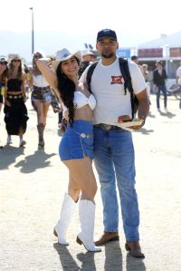 INDIO, CALIFORNIA - APRIL 26: (FOR EDITORIAL USE ONLY) Festivalgoers attend the 2024 Stagecoach Festival at Empire Polo Club on April 26, 2024 in Indio, California. (Photo by Frazer Harrison/Getty Images for Stagecoach)