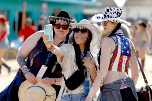 INDIO, CALIFORNIA - APRIL 26: (FOR EDITORIAL USE ONLY) Festivalgoers attend the 2024 Stagecoach Festival at Empire Polo Club on April 26, 2024 in Indio, California. (Photo by Frazer Harrison/Getty Images for Stagecoach)