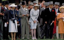 View of various members of the British royal family and others as they watch the Royal Ascot derby, Ascot, England, June 4, 1986. Among those pictured are Anne, Princess Royal (left, in white skirt), Diana, Princess of Wales (1961 - 1997) (center, in polka dots), and Queen Elizabeth the Queen Mother (1900 - 2002) (right, in peach). (Photo by Derek Hudson/Getty Images)