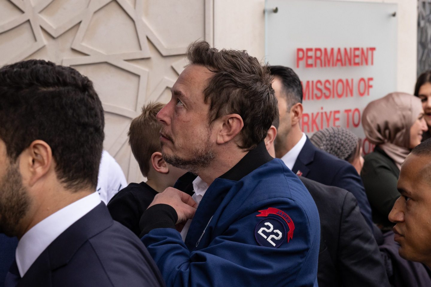 Elon Musk, chief executive officer of Tesla, center, arrives to the Turkish House to meet Turkish President Recep Tayyip Erdogan in New York, US, on Sunday, Sept. 17, 2023. Erdogan hosted Musk to discuss cooperation on a range of subjects from space technology to electric-vehicle batteries. Photographer: Yuki Iwamura/Bloomberg via Getty Images