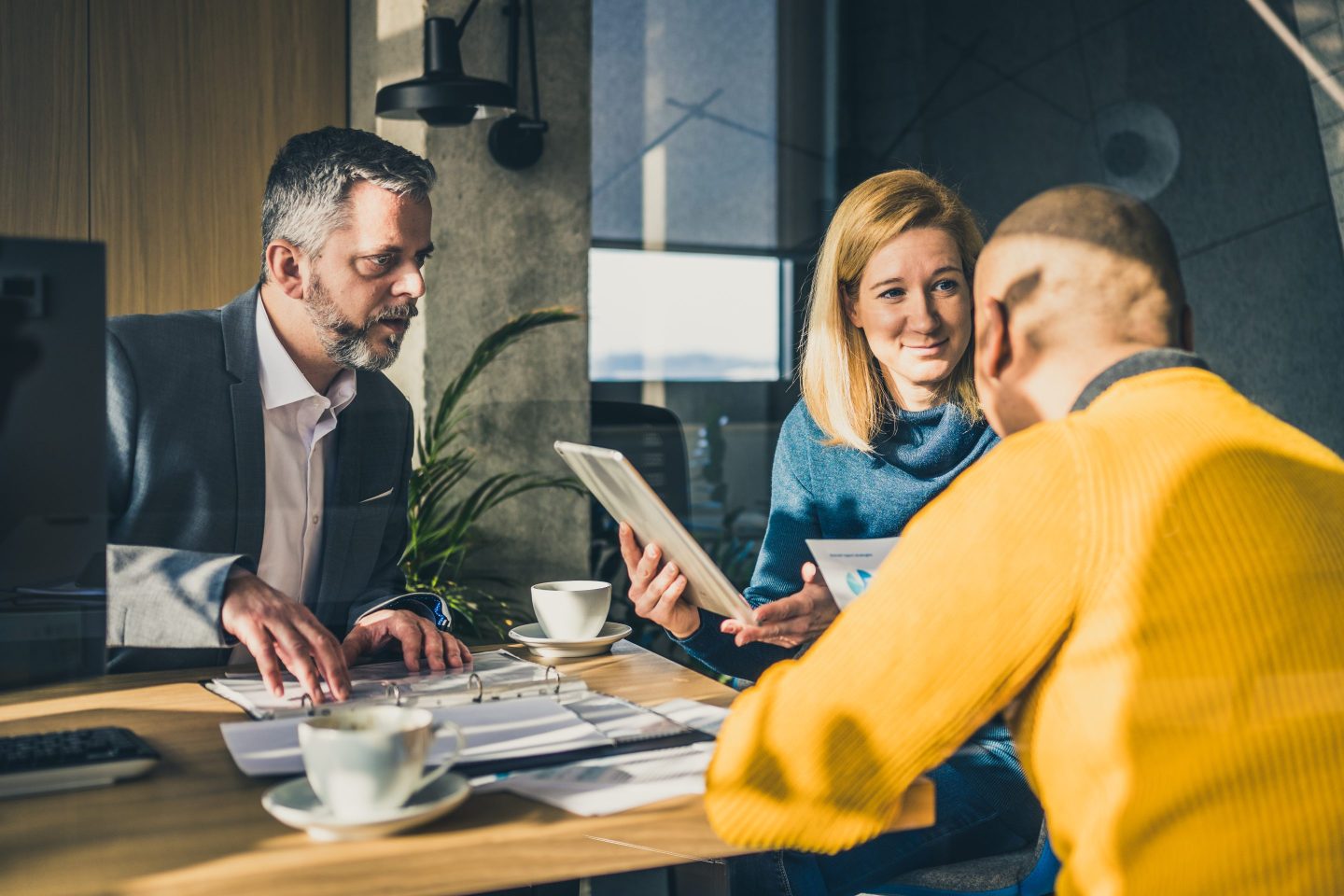 Couple in a financial advisor's office talking.