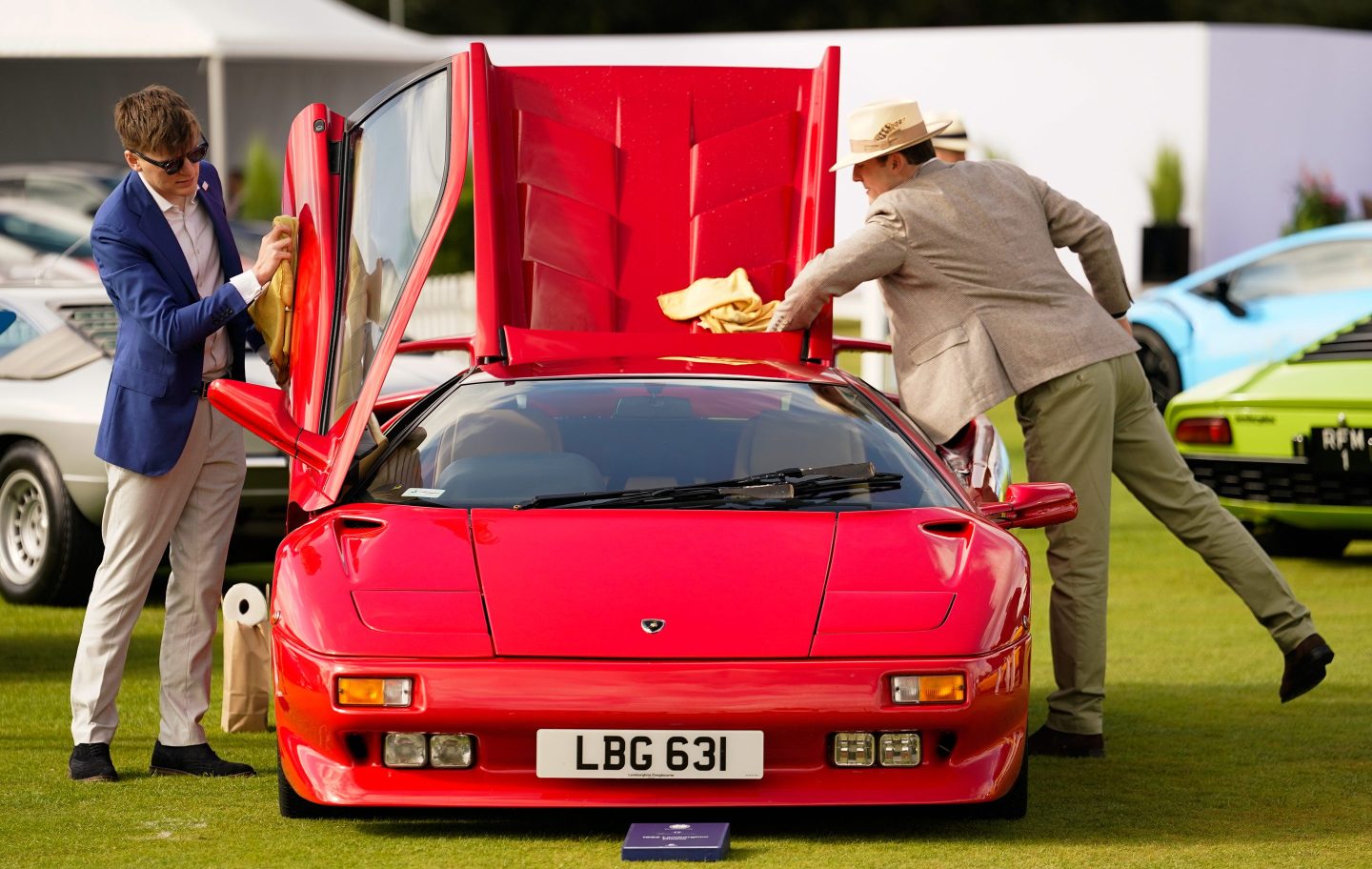 People clean a 1992 Lamborghini Diablo during the opening day of the Salon Prive Concours d&#039;Elegance at Blenheim Palace in Oxfordshire. The event will see a host of luxury car manufacturers premiere their new models. Picture date: Wednesday August 30, 2023. (Photo by Andrew Matthews/PA Images via Getty Images)